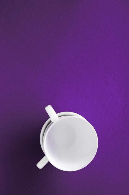 Kitchen table decor and drinks menu concept - white tableware crockery set empty cup on purple flatlay background