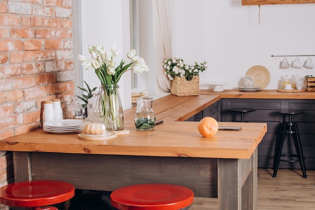 Kitchen table with flowers and dishes