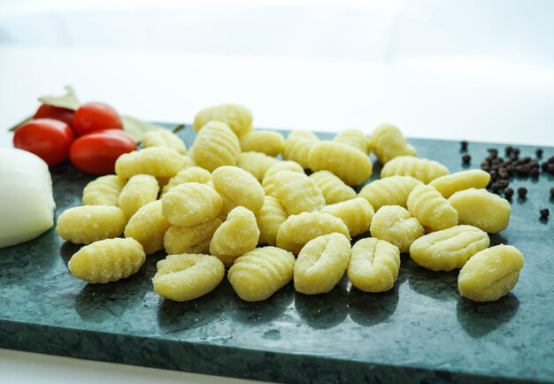 Kitchen table with fresh gnocchi ready to boil