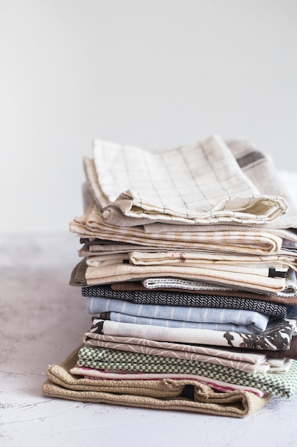 kitchen textile. stack of fabrics in different colors and textures, close-up. kitchen towels