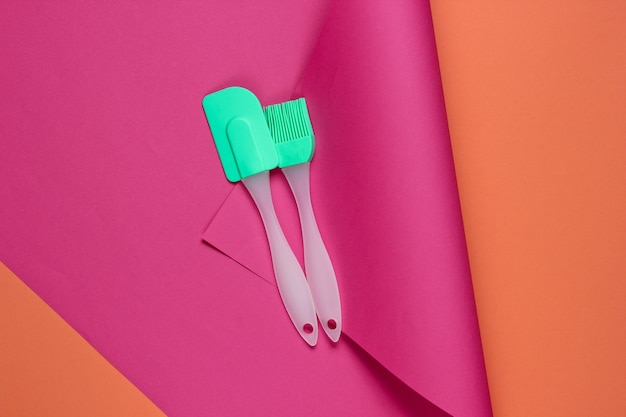 Kitchen tools on a colored paper