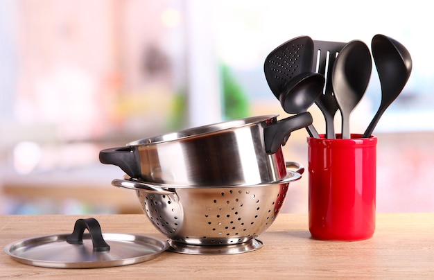 Photo kitchen tools on table in kitchen