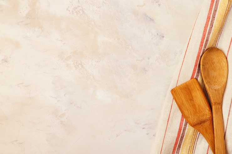 Kitchen towel with wooden kitchenware
