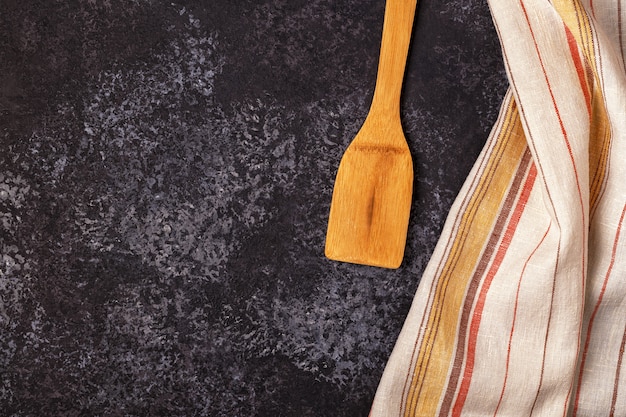 Kitchen towel with wooden kitchenware