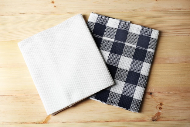 Photo kitchen towels on wooden background