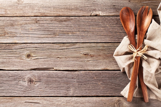 Kitchen utensil over wooden table background