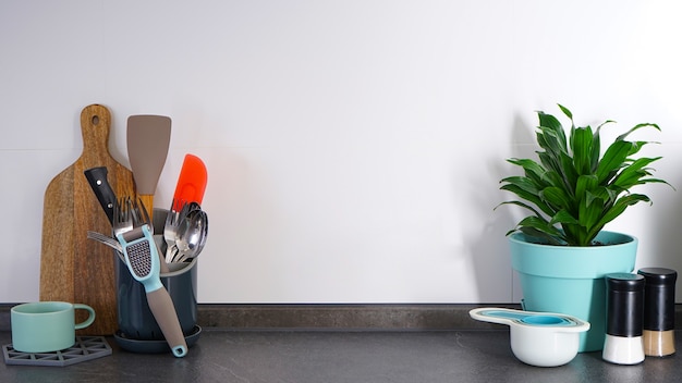 Kitchen utensils on the background of the kitchen, place for text.    Kitchen interior, background.