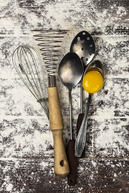 kitchen utensils on flour background