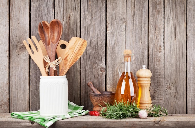 Kitchen utensils herbs and spices on shelf