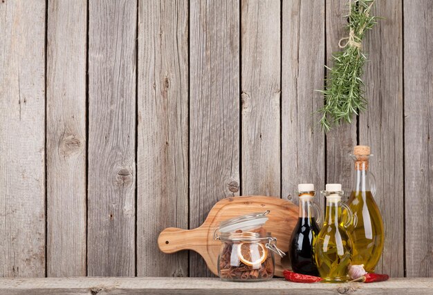 Kitchen utensils herbs and spices on shelf