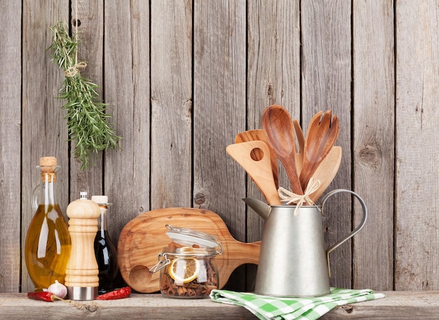 Kitchen utensils herbs and spices on shelf