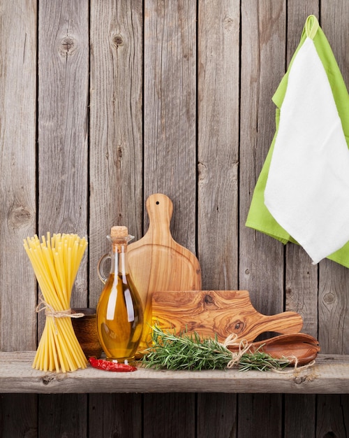 Kitchen utensils herbs and spices on shelf