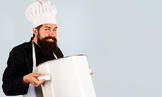 Kitchen utensils man in chef uniform with saucepan bearded cook with pot healthy food cooking