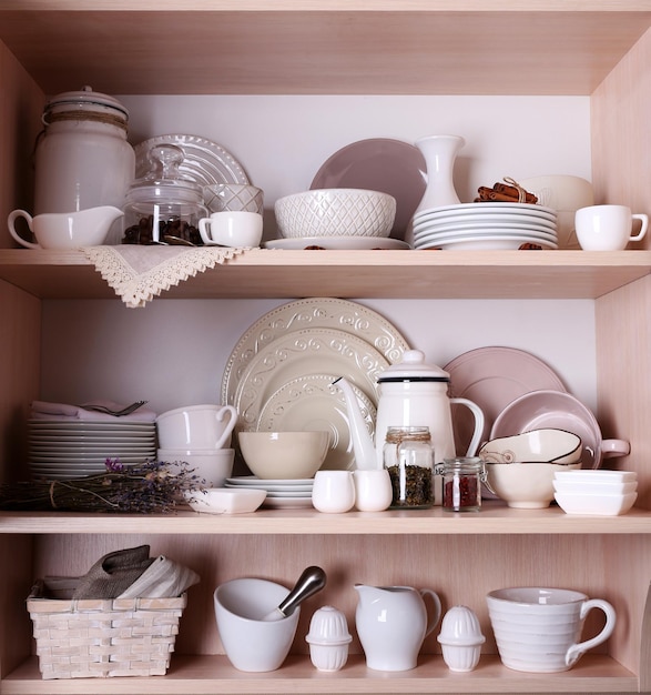 Kitchen utensils and tableware on shelves