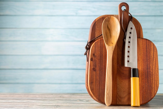 Kitchen utensils on wooden background