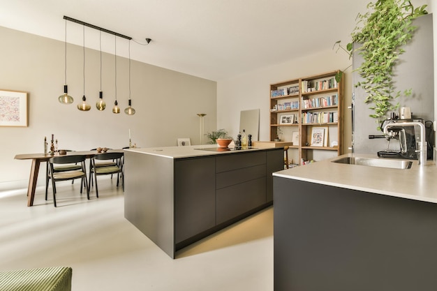 A kitchen with a large island and a dining room