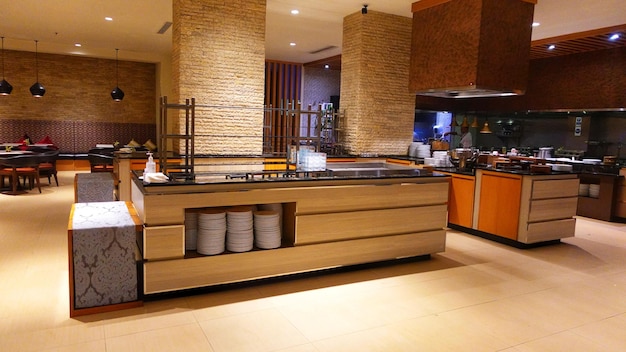 a kitchen with a stove and a microwave on the counter