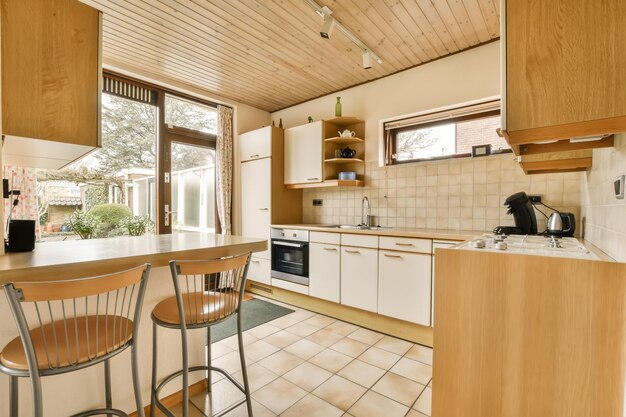 A kitchen with a table and chairs and a sink