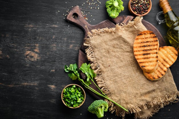 Kitchen wooden board with ingradents cooking concept Top view Free copy space