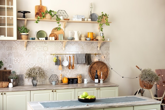 Photo kitchen wooden shelves with various ceramic jars and cookware open shelves in the kitchen