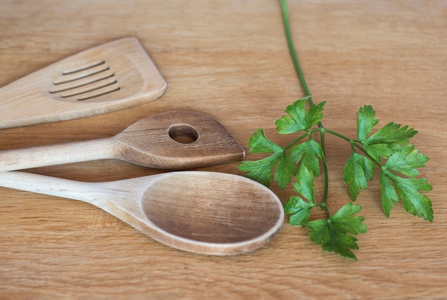 Kitchen wooden spatulas on wooden surface Kitchen tools