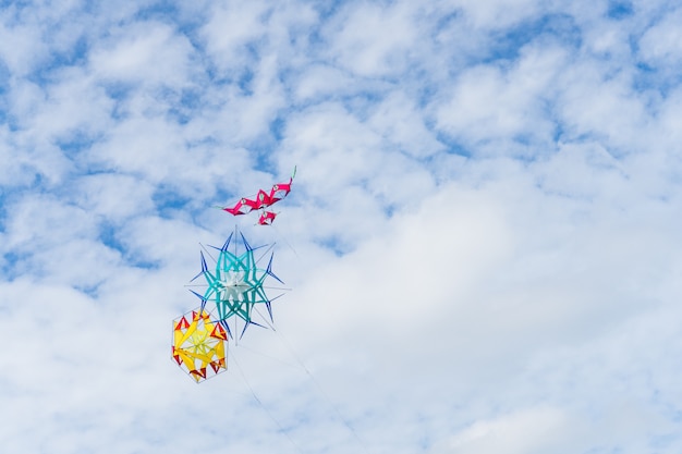 Kite flying in the sky among the clouds