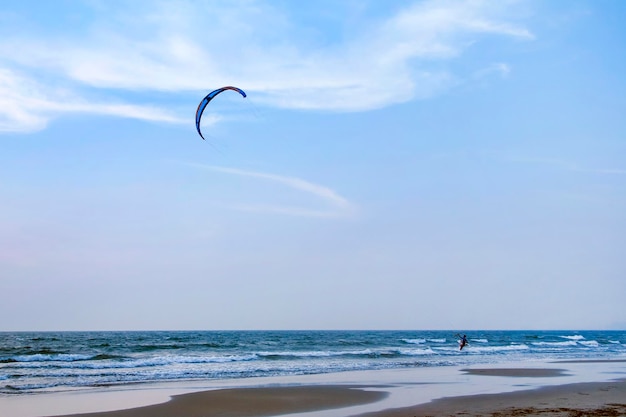 Kitesurfing and man on a waves