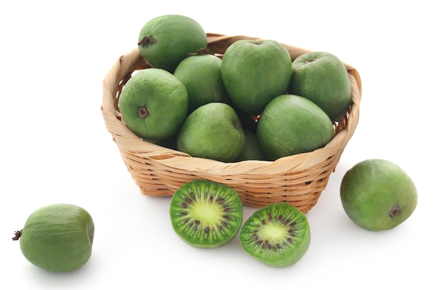 Kiwi berry in a basket over white backgroud