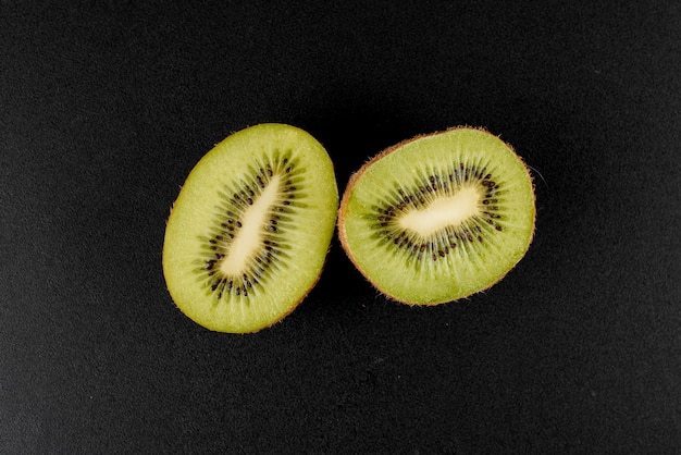 Kiwi on black surface