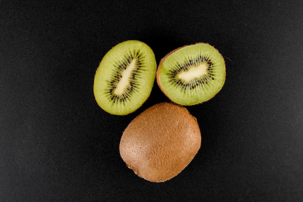 Kiwi on black surface