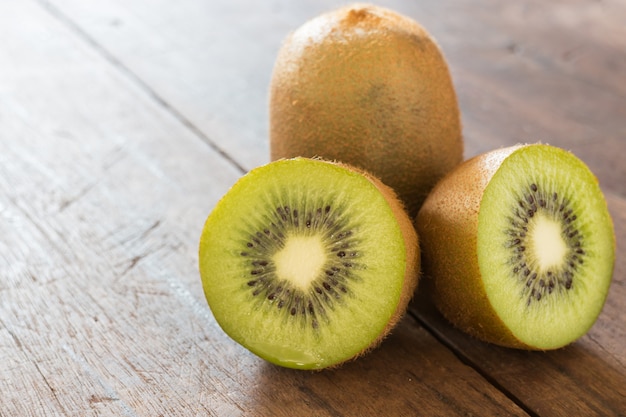 Kiwi fruit on brown wooden background