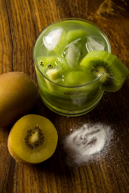 Kiwi Fruit Caipirinha of Brazil on wooden table