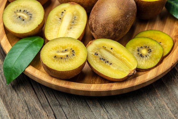 Kiwi fruit close up of fresh and juicy yellow kiwifruit sliced Food background Close up
