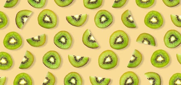 Kiwi fruit isolated on yellow background