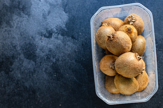 Kiwi fruit in a plastic container