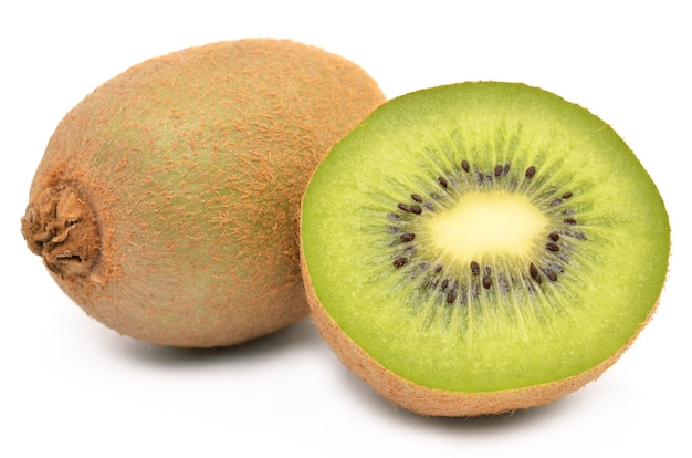 Kiwi fruit on a white surface