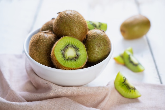 Kiwi fruit on white wooden table, Tropical fruit