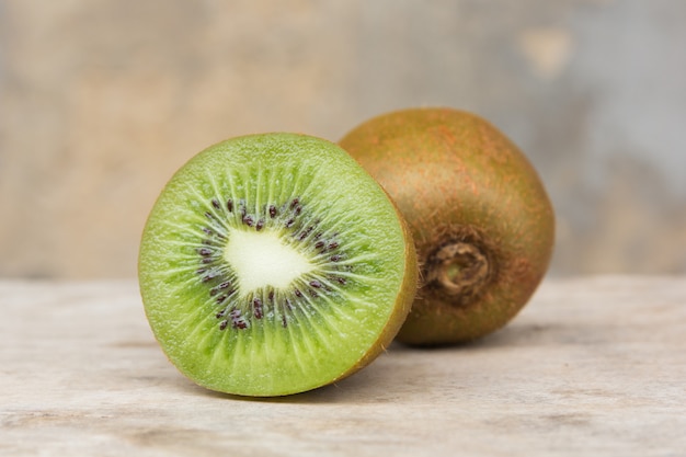 Kiwi fruit on wooden background