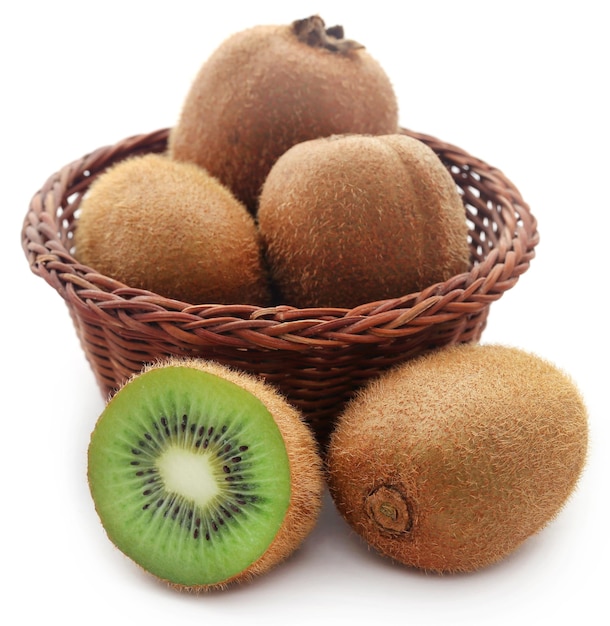 Kiwi fruits in a basket over white background