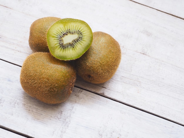 Kiwi fruits on white wooden