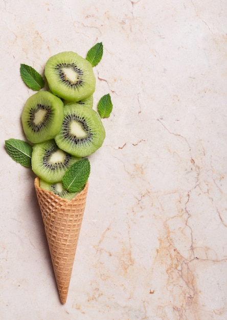 Kiwi ice cream with cone