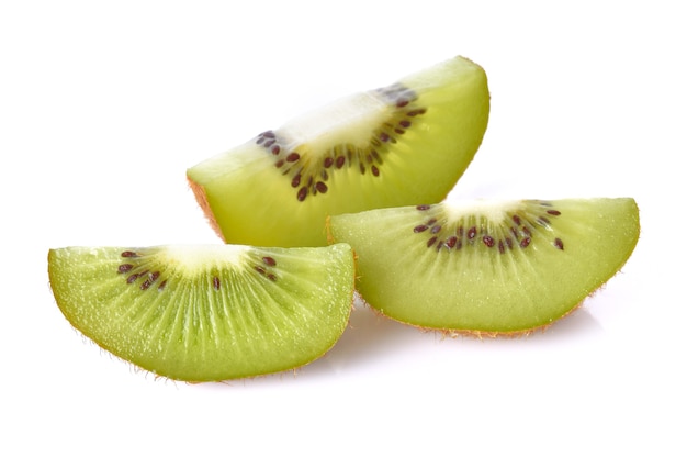 Kiwi pieces on white surface