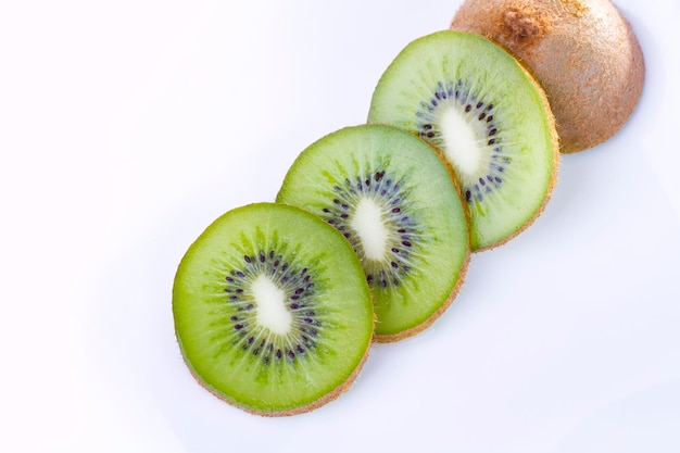 Kiwi slices on white plate