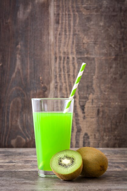 Kiwi smoothie on a rustic wooden wall