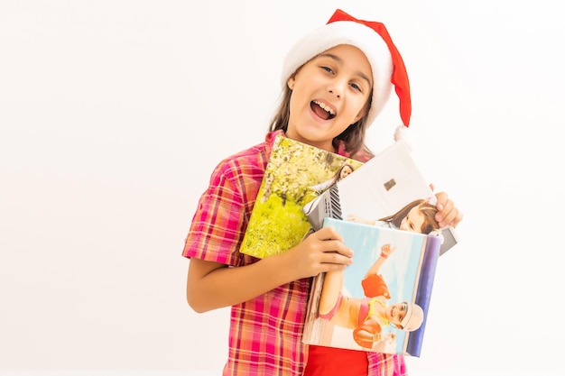 Klein meisje met foto's op canvas Op Kerstmis