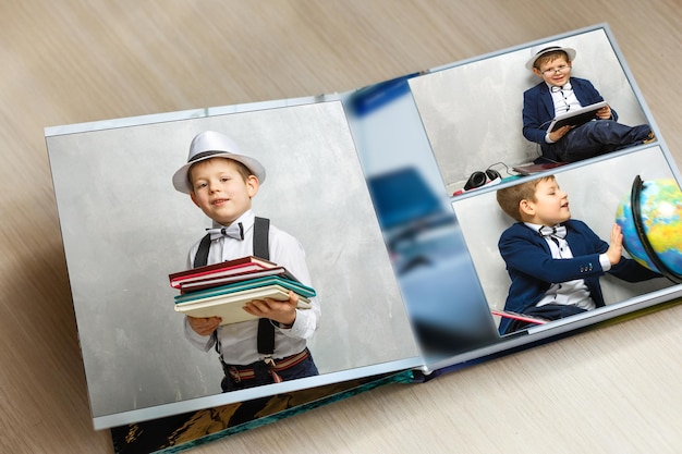 kleine jongen afstuderen fotoboek, schoolalbum.