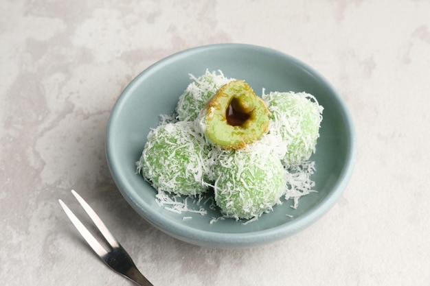 Klepon is Indonesian popular traditional snack made from glutinous rice flour with brown sugar