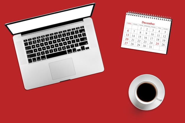 Kleurendesktop met computer, koffie en kalender voor 25 december