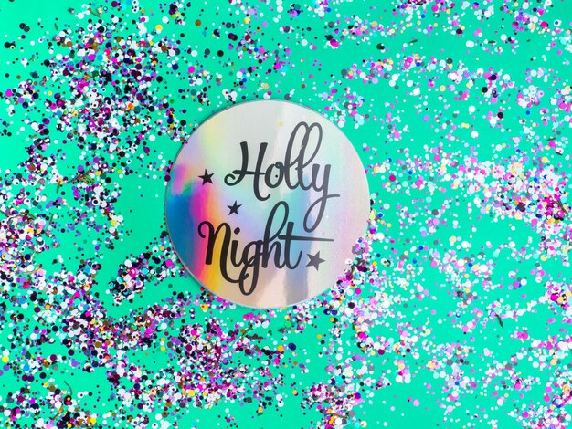 Kleurrijke Sparkling Glitter confetti Kerstvakantie abstracte achtergrond geïnspireerd door neo mint kleur van 2020 holly night tekst in holografisch papier