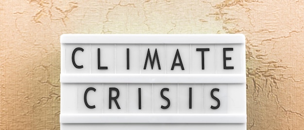 Foto klimaatcrisis tekst banner aarde klimaatveranderingen concept achtergrond foto